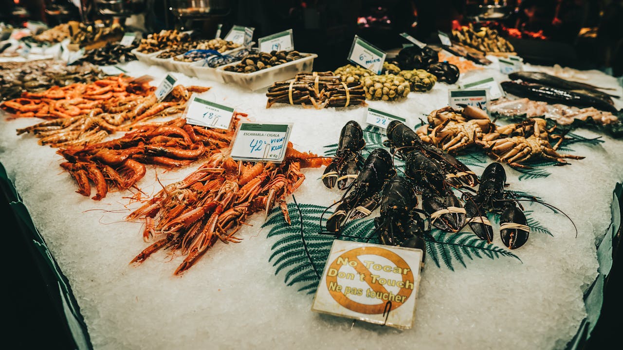 A vibrant display of fresh seafood at a market in Barcelona, Spain.